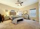 Spacious bedroom with plush bed, neutral tones, and ample natural light at 3415 S Mellonville Ave, Sanford, FL 32773