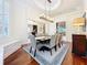 Bright dining area with hardwood floors, a large table, and a lovely chandelier at 3415 S Mellonville Ave, Sanford, FL 32773