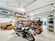 Garage with multiple motorcycles and storage solutions at 3415 S Mellonville Ave, Sanford, FL 32773