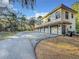 Five-car garage with long driveway and mature trees at 3415 S Mellonville Ave, Sanford, FL 32773