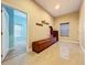 Bright hallway with tiled floors and built-in bench seating at 3415 S Mellonville Ave, Sanford, FL 32773