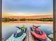 Two jet skis docked on a lakefront platform at sunset at 3415 S Mellonville Ave, Sanford, FL 32773