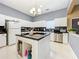 Modern kitchen with white cabinets and island at 3415 S Mellonville Ave, Sanford, FL 32773