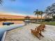 Serene lakeside patio with Adirondack chairs and sunset views at 3415 S Mellonville Ave, Sanford, FL 32773