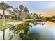 Tranquil lakefront view showcasing lush greenery and calm waters at 3415 S Mellonville Ave, Sanford, FL 32773