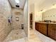 Spa-like shower with multiple shower heads and mosaic tile at 3415 S Mellonville Ave, Sanford, FL 32773