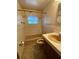 Full bathroom with tub shower and wood cabinet at 3430 N Westmoreland Dr, Orlando, FL 32804