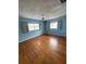 Bright bedroom with hardwood floors and light blue walls at 3430 N Westmoreland Dr, Orlando, FL 32804