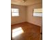 Bright bedroom with hardwood floors and two windows at 3430 N Westmoreland Dr, Orlando, FL 32804