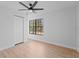 Simple bedroom with hardwood floors and a window at 417 Main Trl, Ormond Beach, FL 32174