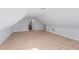 Bright bonus room with modern wood floors and neutral paint, leading into the renovated bathroom space at 417 Main Trl, Ormond Beach, FL 32174