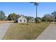 House exterior showcasing a large yard and a long driveway at 417 Main Trl, Ormond Beach, FL 32174