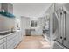 Modern kitchen with stainless steel appliances and white shaker cabinets at 417 Main Trl, Ormond Beach, FL 32174