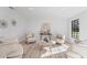 Relaxing living room with comfy armchairs and a large window at 417 Main Trl, Ormond Beach, FL 32174