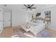 Serene bedroom with a decorative rug, modern lighting, and large windows for ample natural light at 417 Main Trl, Ormond Beach, FL 32174
