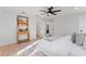 Spacious bedroom features a modern fan, natural light and a view into the attached bathroom at 417 Main Trl, Ormond Beach, FL 32174