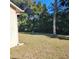 Spacious backyard with grassy lawn and bird bath at 510 N Leavitt Ave, Orange City, FL 32763