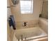 Relax in this bathtub with a window at 510 N Leavitt Ave, Orange City, FL 32763