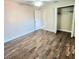 Large bedroom with walk-in closet and wood-look floors at 510 N Leavitt Ave, Orange City, FL 32763