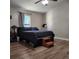 Bright bedroom with wood-look floors and a ceiling fan at 510 N Leavitt Ave, Orange City, FL 32763