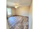 Bright bedroom with wood-look floors and window at 510 N Leavitt Ave, Orange City, FL 32763