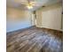 Spacious bedroom with wood-look floors and large closet at 510 N Leavitt Ave, Orange City, FL 32763