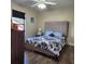 Spacious bedroom with a queen-size bed and wood flooring at 510 N Leavitt Ave, Orange City, FL 32763