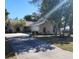 Single-story home with a driveway and landscaped lawn at 510 N Leavitt Ave, Orange City, FL 32763