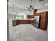 View of kitchen with stainless steel appliances and wood cabinets at 510 N Leavitt Ave, Orange City, FL 32763