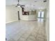 Bright living room with tile floors and open kitchen view at 510 N Leavitt Ave, Orange City, FL 32763