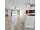 Living room with tile floors and sliding glass doors to backyard at 510 N Leavitt Ave, Orange City, FL 32763