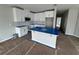 Modern kitchen featuring white cabinets and an island at 5100 Rain Shadow Dr, Saint Cloud, FL 34772