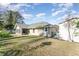 House exterior showcasing a large backyard and shed at 5572 Myakka Ave, Intercession City, FL 33848