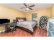 Bedroom with full-size bed, desk, and home office area at 5572 Myakka Ave, Intercession City, FL 33848