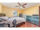 Bright bedroom with a king-size bed and wood floors at 5572 Myakka Ave, Intercession City, FL 33848