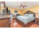 Well-lit bedroom with a king-size bed and dresser at 5572 Myakka Ave, Intercession City, FL 33848