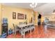 Bright dining area with wood flooring and seating for four at 5572 Myakka Ave, Intercession City, FL 33848