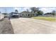 Long concrete driveway with RV parking at 5572 Myakka Ave, Intercession City, FL 33848