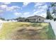 Tan house with white fence and large yard at 5572 Myakka Ave, Intercession City, FL 33848