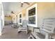 Front porch with rocking chairs and ceiling fans at 5572 Myakka Ave, Intercession City, FL 33848