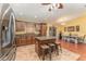 Open concept kitchen with island and breakfast bar at 5572 Myakka Ave, Intercession City, FL 33848