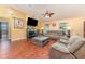 Living room with hardwood floors and fireplace at 5572 Myakka Ave, Intercession City, FL 33848