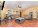 Living room with hardwood floors and comfy sofas at 5572 Myakka Ave, Intercession City, FL 33848