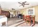 Outdoor kitchen area with stainless steel appliances and dining table at 5572 Myakka Ave, Intercession City, FL 33848