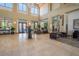 Inviting clubhouse lobby featuring high ceilings, tile flooring, and stylish furnishings at 5767 T Bird Ln, Kissimmee, FL 34746