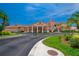 Front exterior view of the clubhouse with covered entrance and lush landscaping at 5767 T Bird Ln, Kissimmee, FL 34746