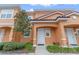 Attractive townhome with tile roof, neat landscaping, and welcoming front entrances at 5767 T Bird Ln, Kissimmee, FL 34746