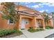 Charming townhome featuring colorful facade, well-maintained landscape, and cozy entryway at 5767 T Bird Ln, Kissimmee, FL 34746