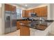 Well-equipped kitchen featuring stainless steel appliances and dark granite countertops at 5767 T Bird Ln, Kissimmee, FL 34746