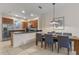 Contemporary kitchen and dining area with stainless steel appliances and cozy seating at 5767 T Bird Ln, Kissimmee, FL 34746